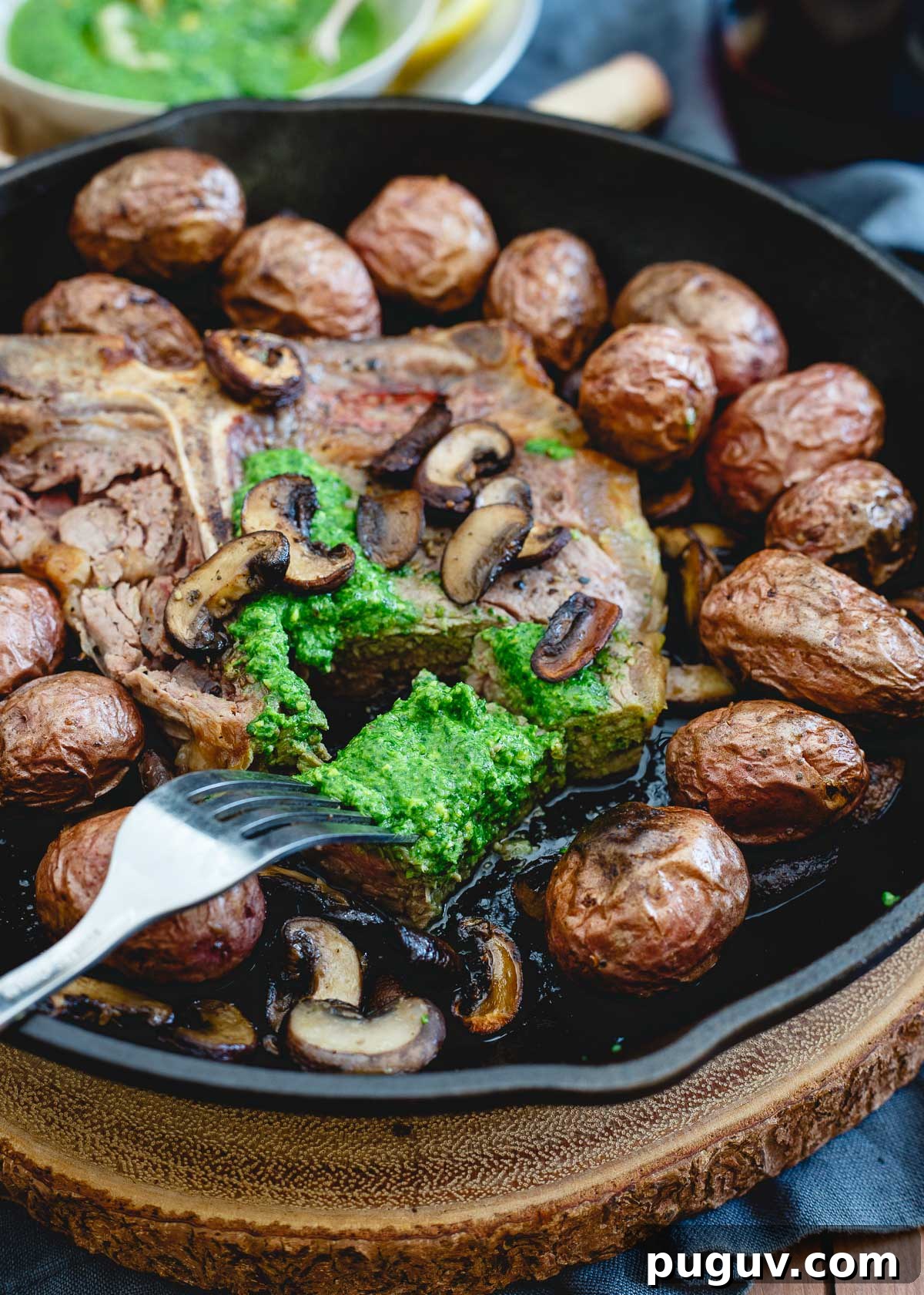 This easy Porterhouse steak skillet is topped with a spinach horseradish pesto for a pop of brightness. This easy Porterhouse steak skillet is topped with a spinach horseradish pesto for a pop of brightness.