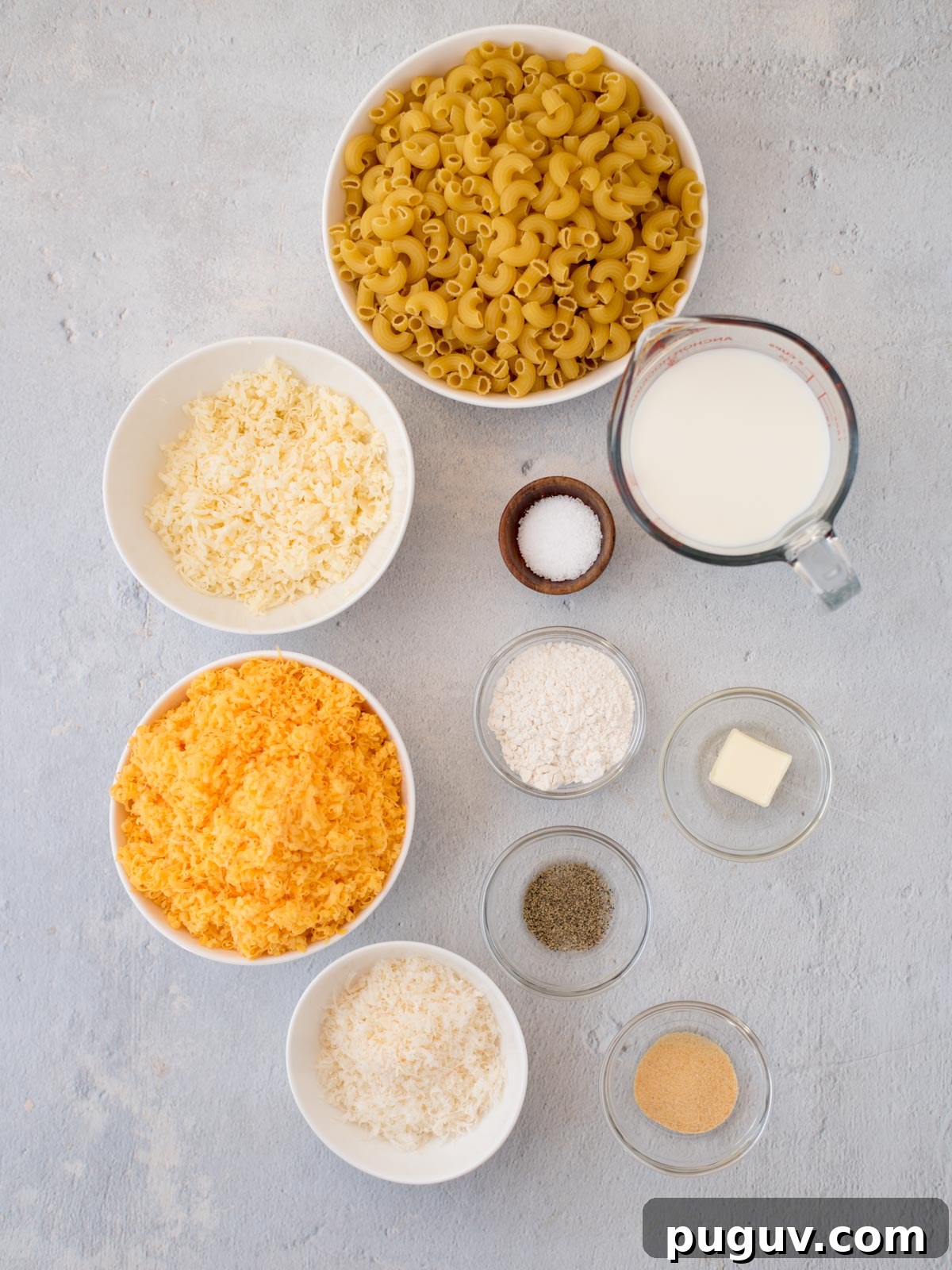 Creamy Baked Macaroni and Cheese Casserole 3 Ingredients shown are used to prepare baked mac and cheese.