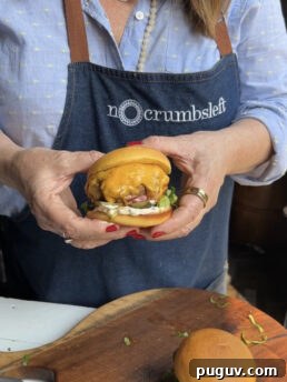 Teri holding a burger.
