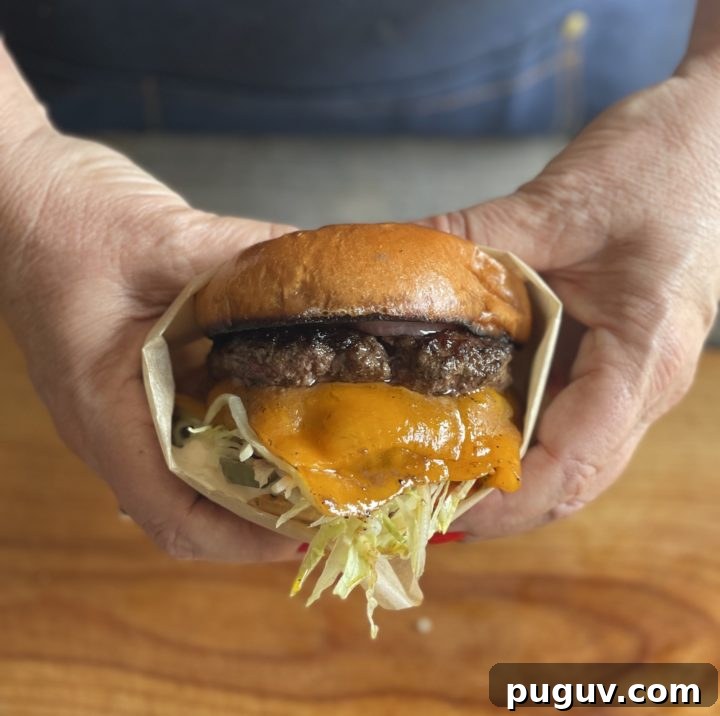 Juicy Cheeseburger Sliders Recipe That Tops the Rest 3 Smashburger on a griddle