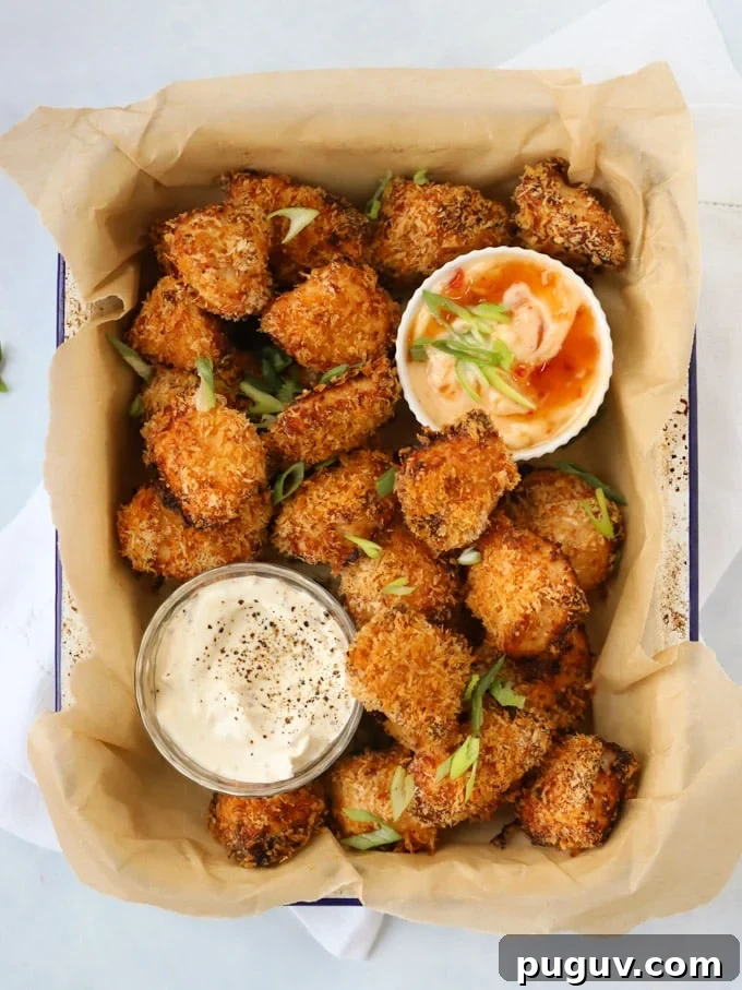 Crispy Homemade Chicken Nuggets Recipe for Family Meals 2 Cooked Homemade Chicken Nuggets with dips in a tray.