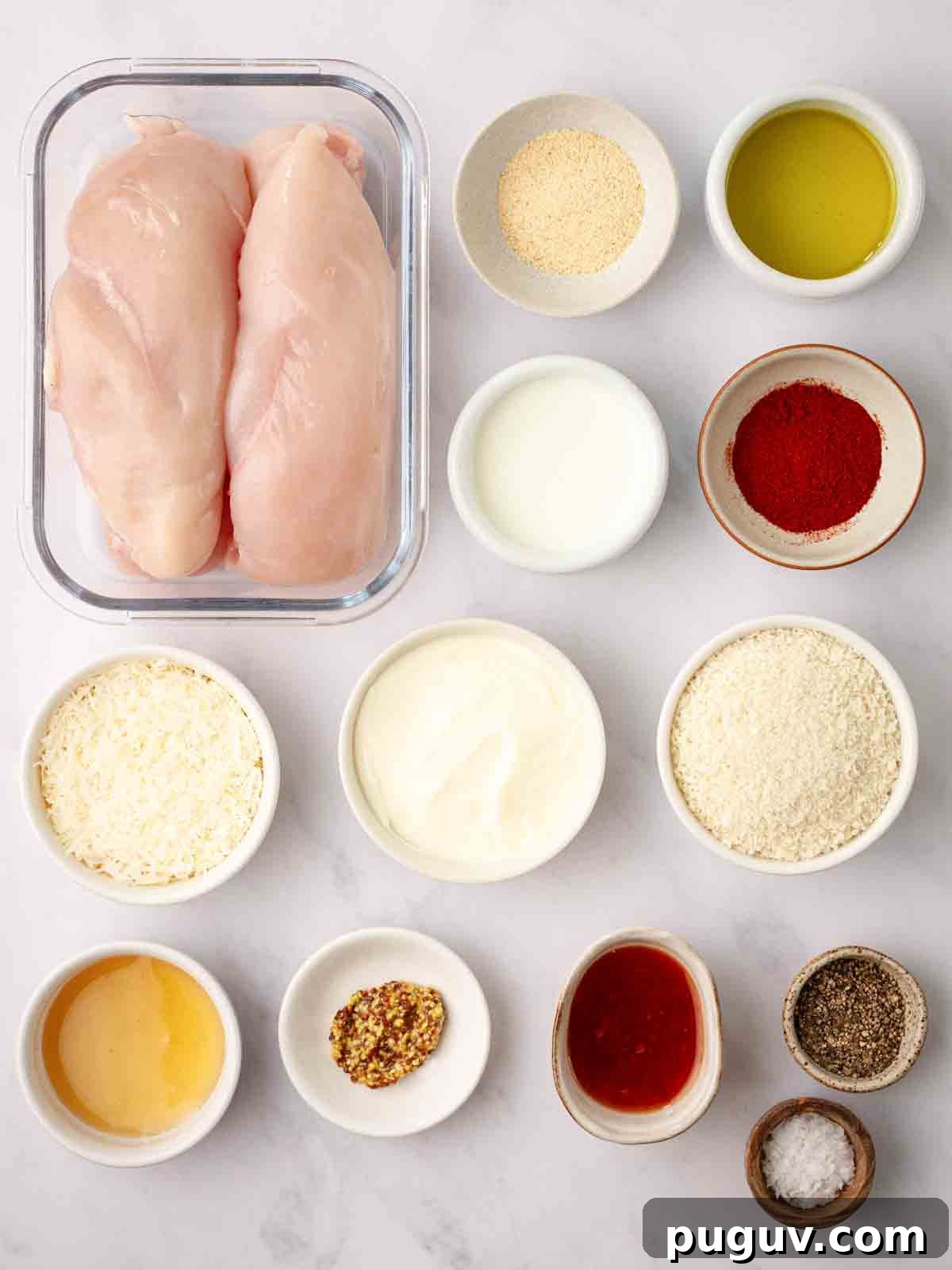 Crispy Homemade Chicken Nuggets Recipe for Family Meals 4 The ingredients for homemade chicken nuggets laid out on a counter top.