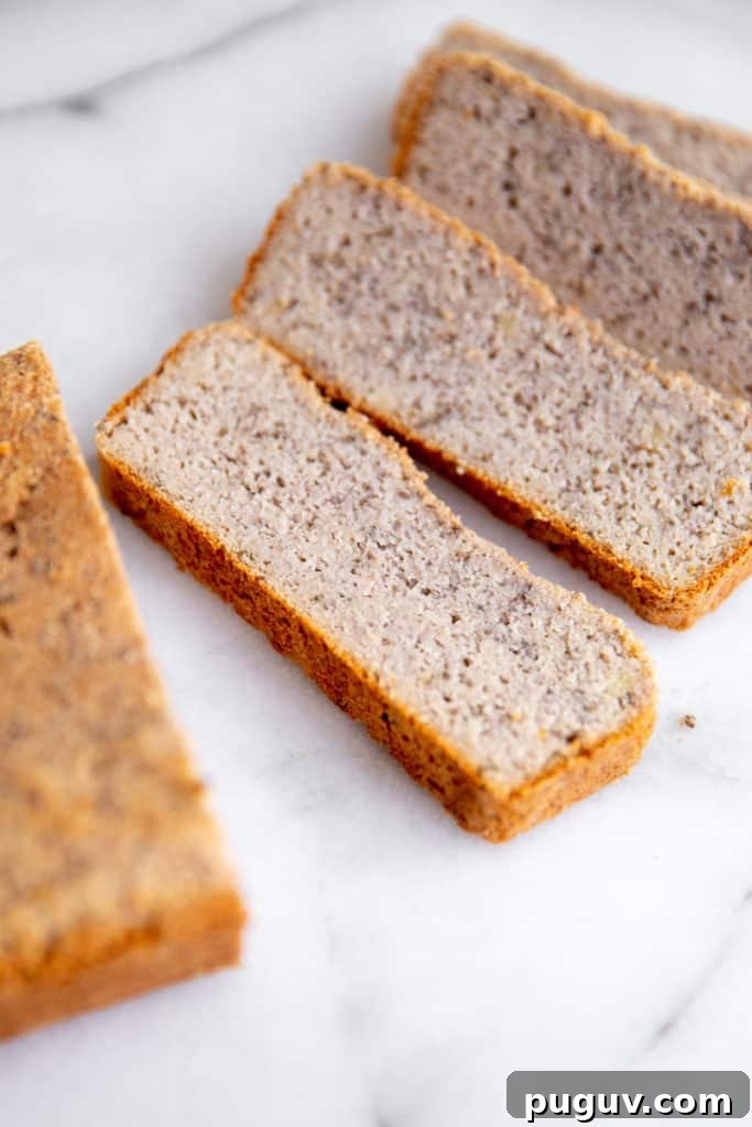 No-Yeast Vegan Almond Bread (Grain-Free, Paleo Recipe) 2 Slices of vegan almond bread on a marble surface.