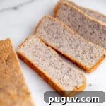No-Yeast Vegan Almond Bread (Grain-Free, Paleo Recipe) 11 Vegan almond flour bread slices on a marble surface.