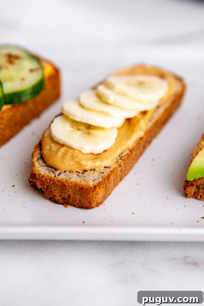 No-Yeast Vegan Almond Bread (Grain-Free, Paleo Recipe) 4 A slice of paleo almond bread topped with nut butter and banana slices.