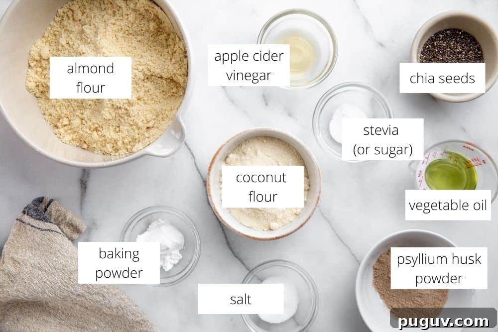 No-Yeast Vegan Almond Bread (Grain-Free, Paleo Recipe) 5 All of the ingredients for the almond flour bread recipe arranged on a marble surface with labels.