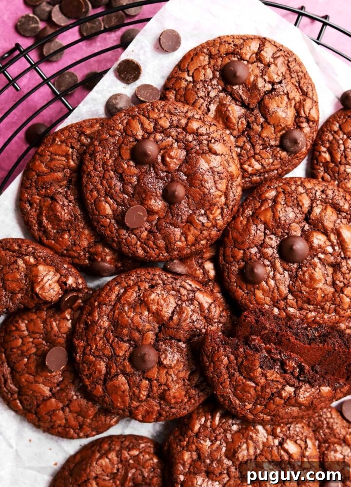 Fudgy Flourless Brownie Cookies — Gluten-Free Chocolate Treats 4 flourless brownie cookies on cooling rack
