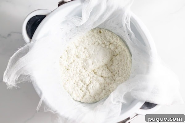 cheese draining in cheesecloth