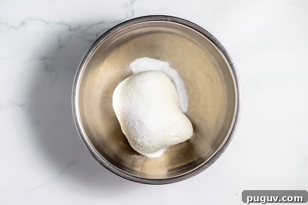 homemade cheese being salted