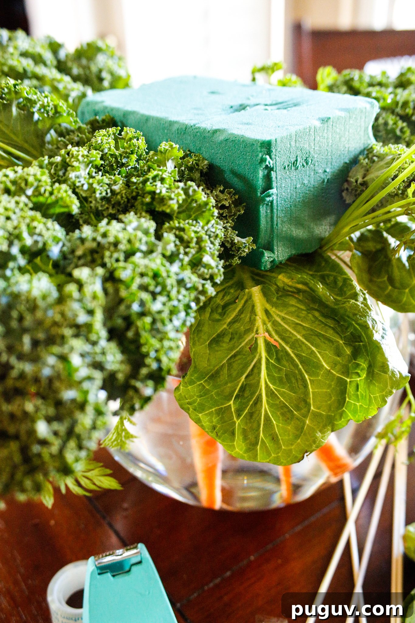 Create a Stunning Vegetable Floral Centerpiece for Any Table 7 Lettuce and kale creating a base around the floral foam