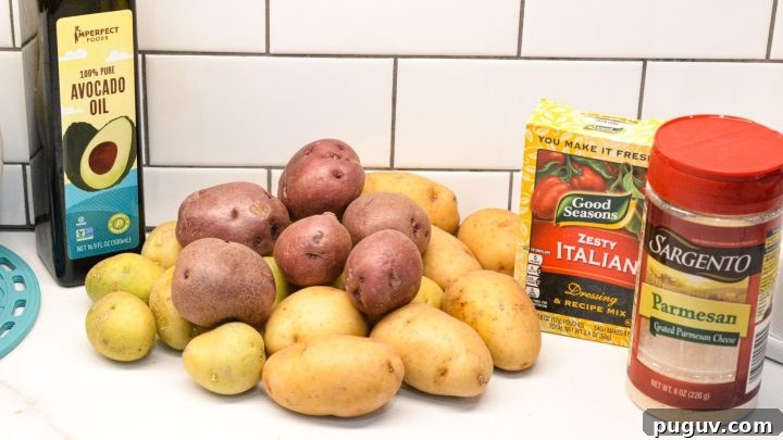 Parmesan Crusted Potatoes Ingredients are baby potatoes, grated parmesan cheese, Italian dressing seasoning mix and avocado oil