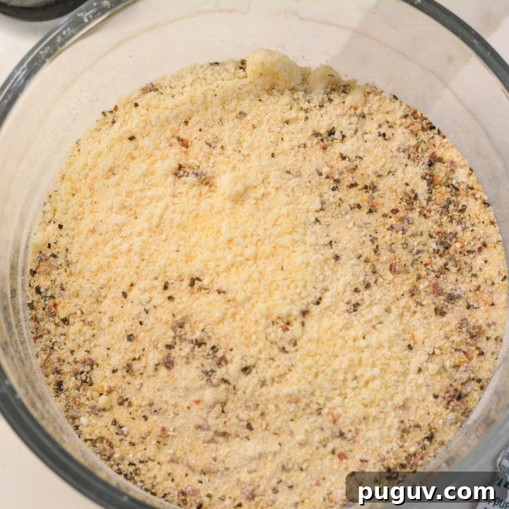 In a large bowl, combine Parmesan cheese and Italian dressing mix. Mix well until it is completely combined throughout.