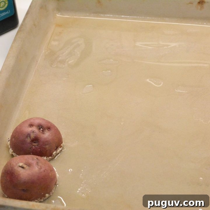 Place the potatoes cut side down on the prepared baking sheet. Make sure they’re spaced apart so they crisp up nicely.