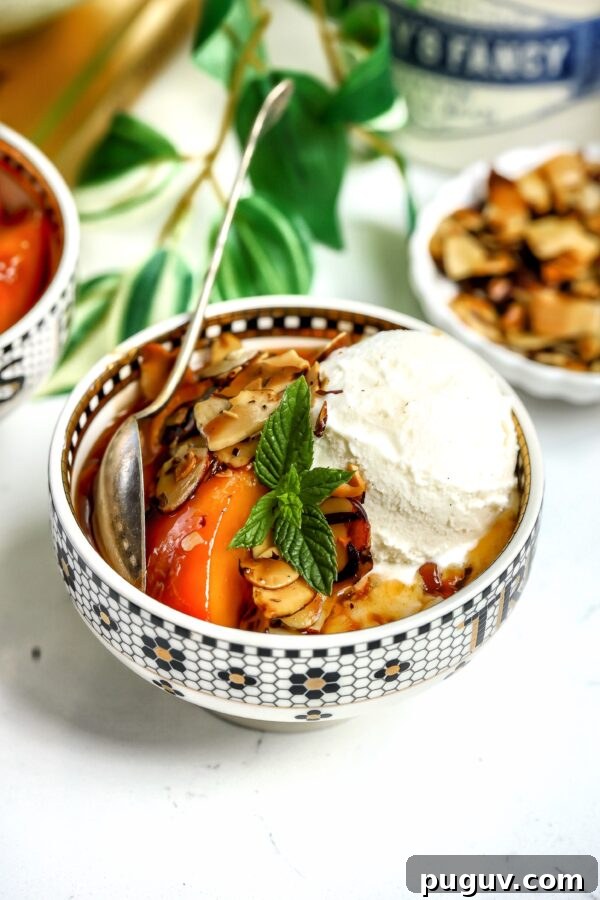 Juicy Beef Tenderloin Stacks with Garlic Herb Butter 6 caramelized Amaretto Peaches with toasted almond in a bowl, topped with ice cream and mint.