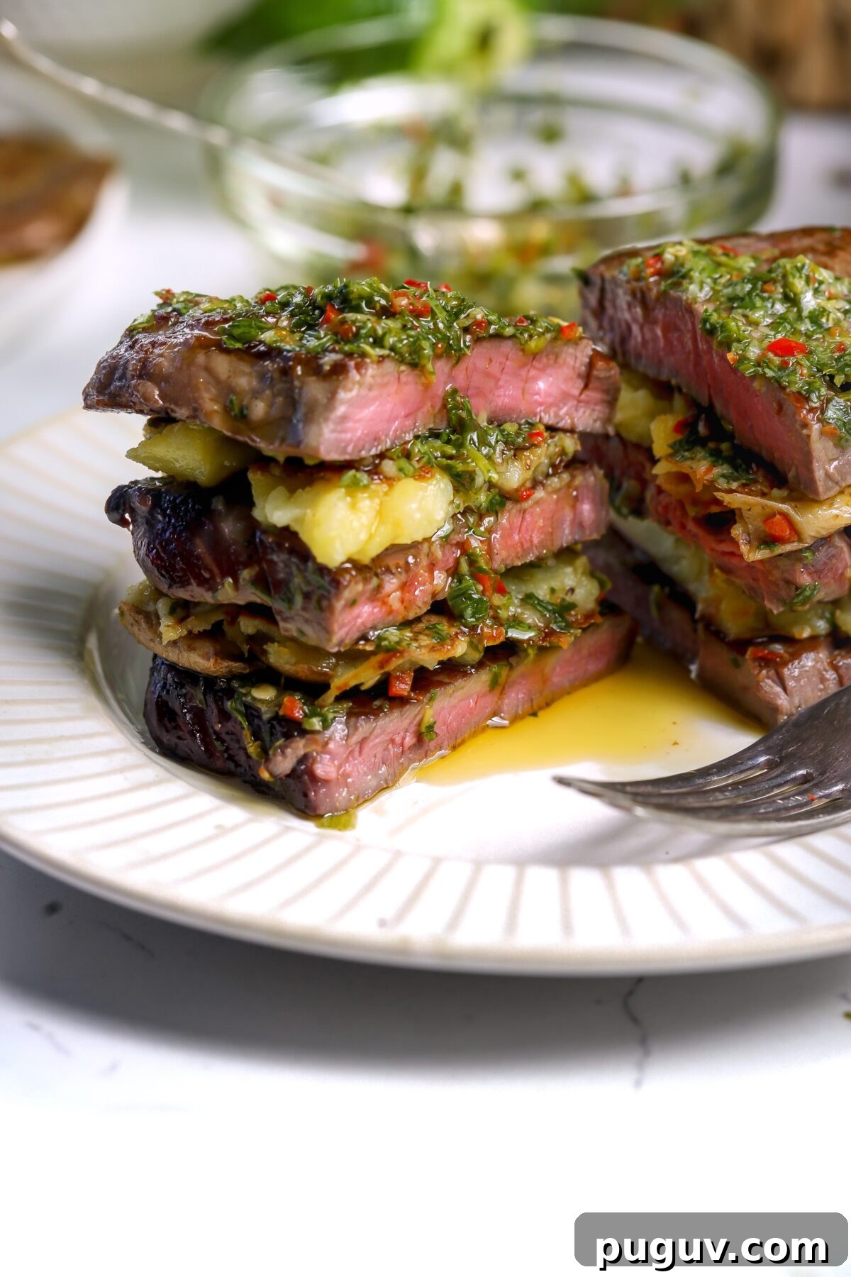 Juicy Beef Tenderloin Stacks with Garlic Herb Butter 7 beef tenderloin grilled to perfection on a griddle and then layered in stacks with potatoes and chimichurri sauce.