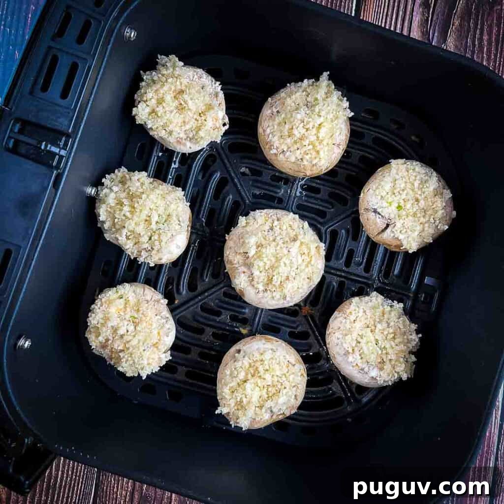 The prepared mushrooms in the air fryer basket.