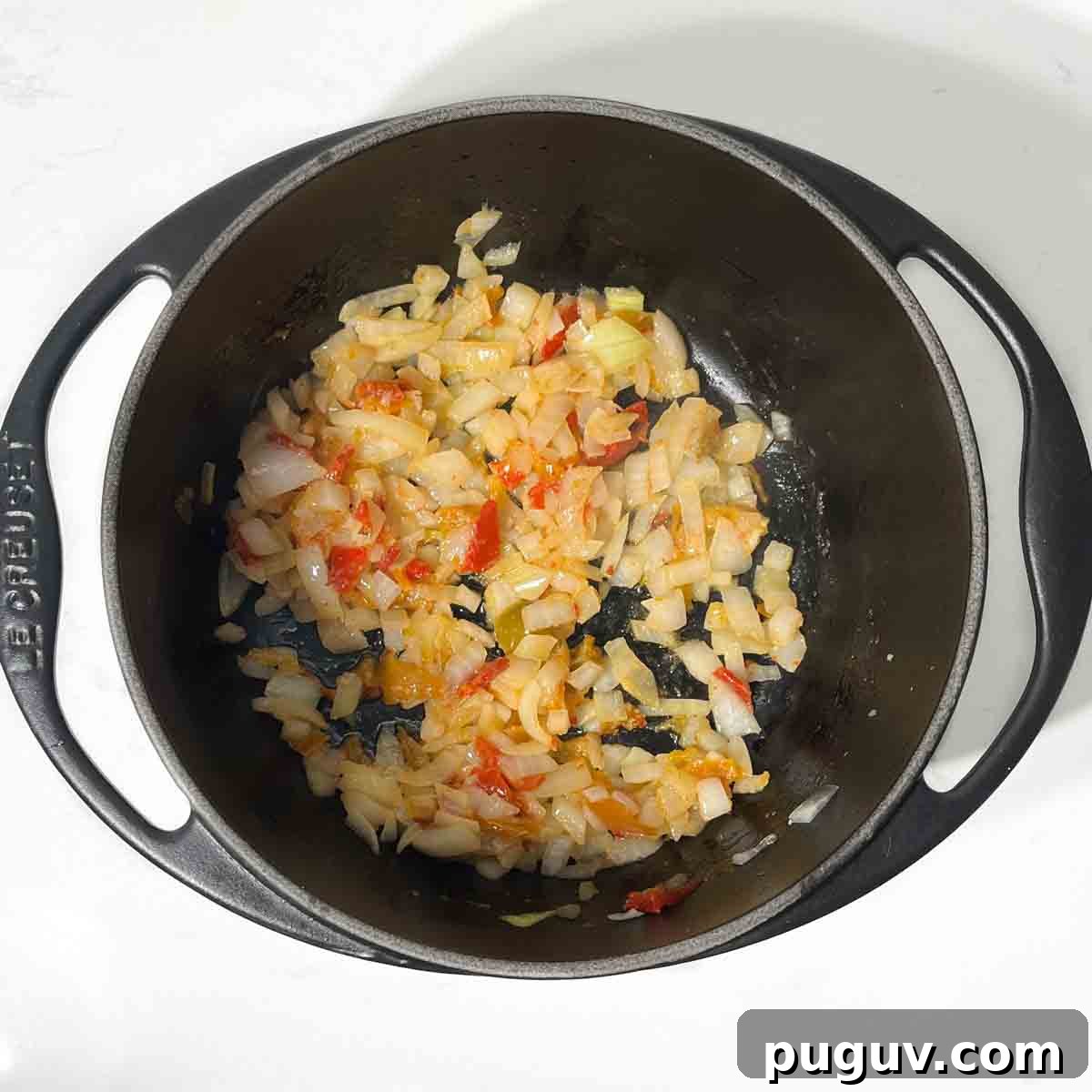 Authentic Spanish Arroz Amarillo (Saffron Yellow Rice) 5 Fried onions, peppers and garlic in a heavy-based saucepan.