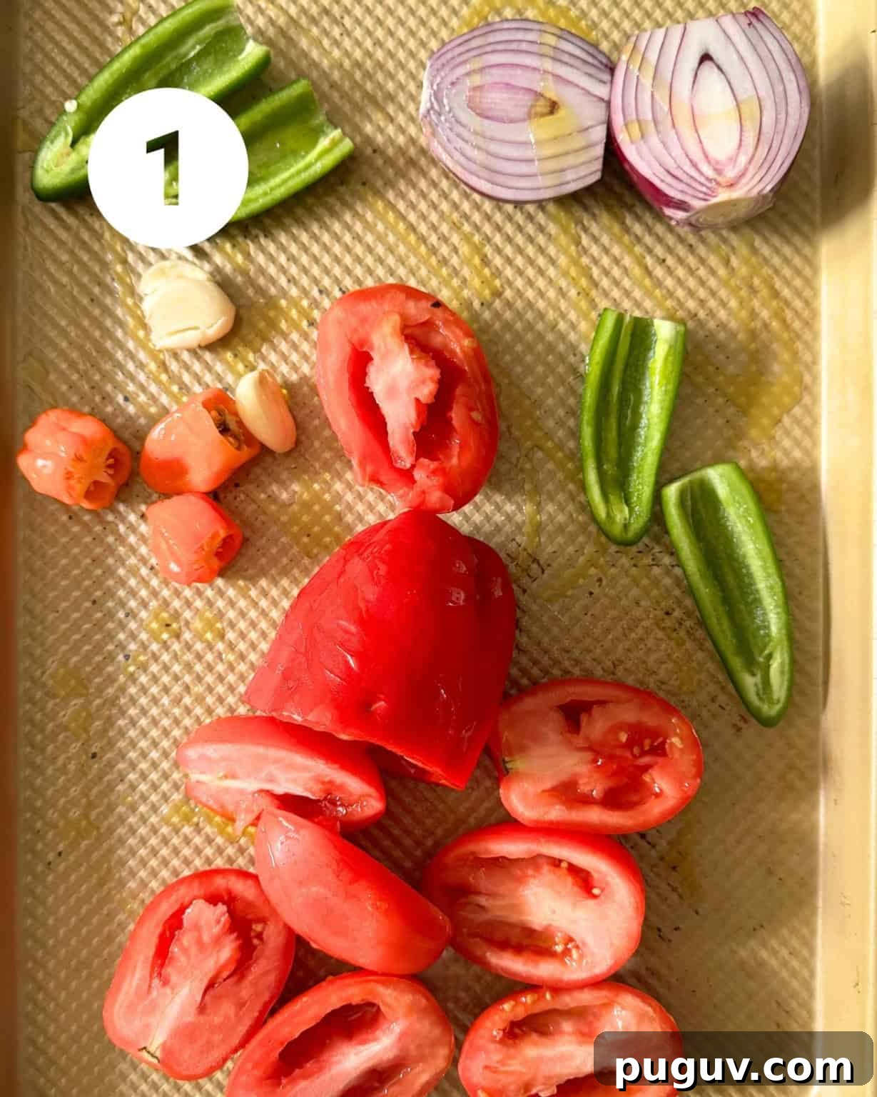 Mango Habanero Salsa Recipe — Sweet Heat with Fresh Mango 4 bell peppers, red onions, jalapenos, habaneros, and garlic coated in olive oil on a baking sheet.