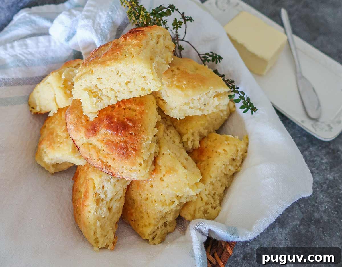 Top Gluten-Free Rolls & Buns: Soft, Fluffy Recipes You’ll Love 8 gluten free milk rolls in a towel with butter dish on the side
