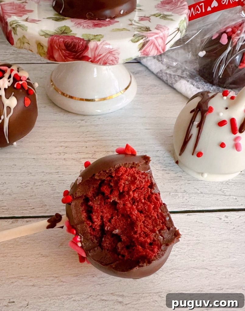 Red Velvet Cake Pops: Bite-Sized Dessert Recipe Guide 10 Bite out of the red velvet cake pop.
