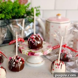 Red Velvet Cake Pops: Bite-Sized Dessert Recipe Guide 12 Cake pops on a stick and wrapped for valentines day.