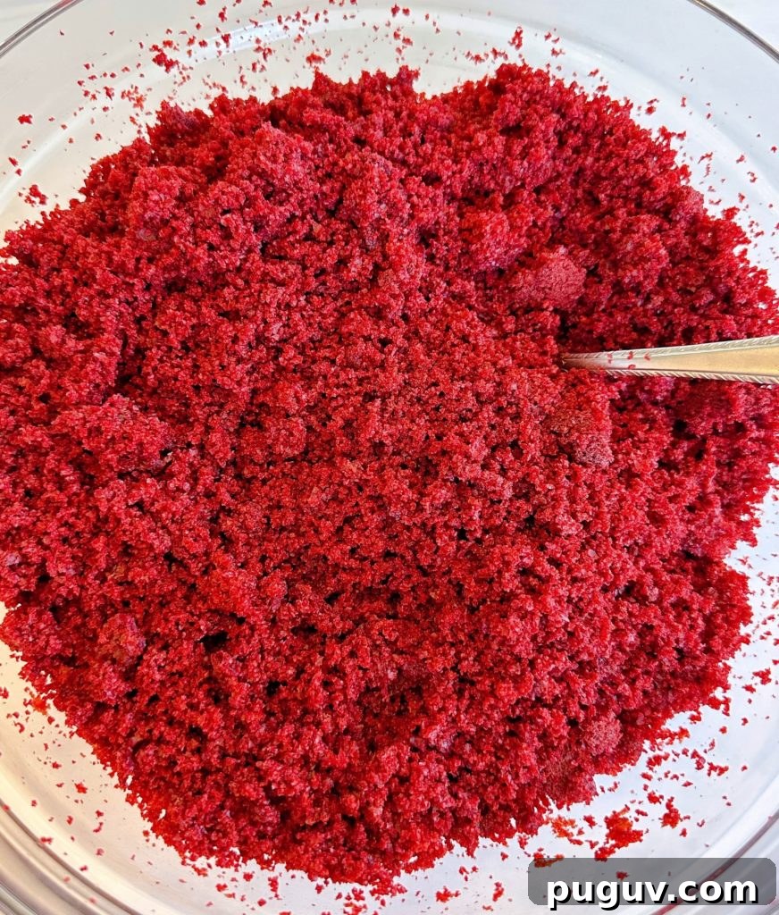Red Velvet Cake Pops: Bite-Sized Dessert Recipe Guide 4 The cake crumbled in a large bowl.
