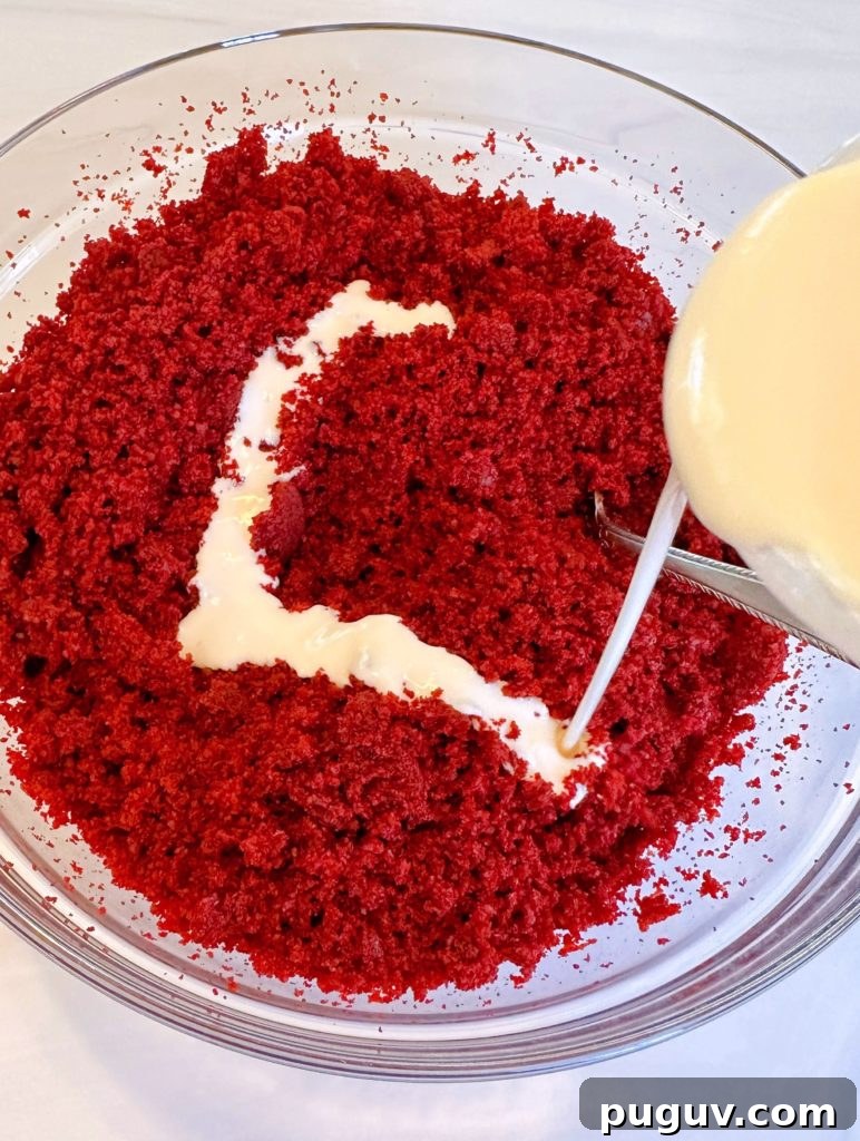 Red Velvet Cake Pops: Bite-Sized Dessert Recipe Guide 5 Pouring melted frosting over cake crumbs.