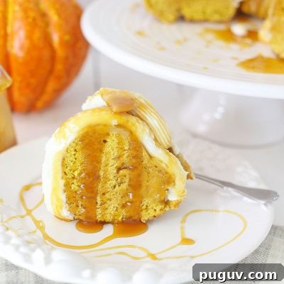 Fresh Pumpkin Bundt Cake with Creamy Buttercream Frosting 7 Close up image of a slice of pumpkin bundt cake with buttercream frosting, drizzled with caramel sauce