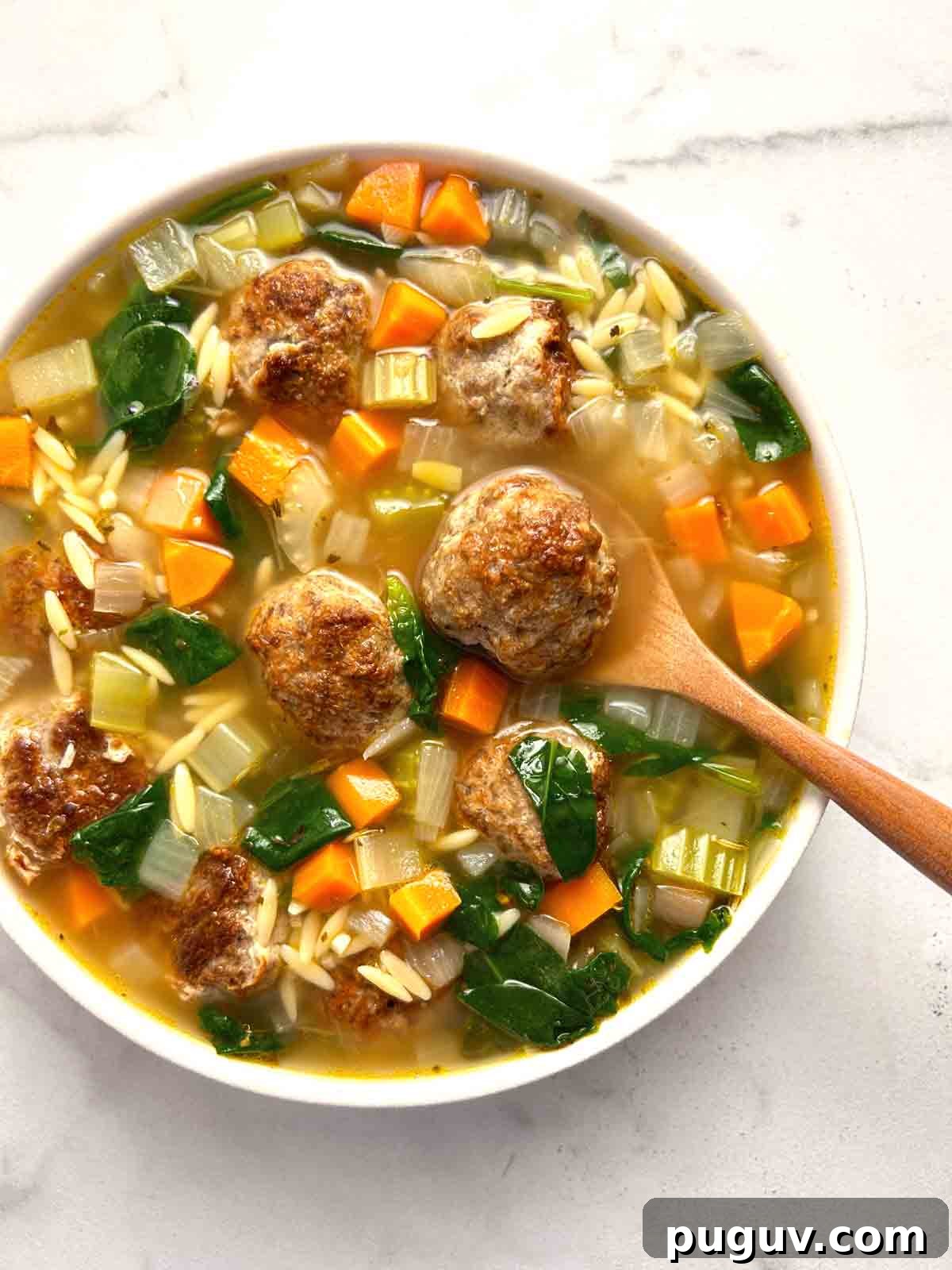 Classic Italian Wedding Soup Recipe — Authentic Homemade Flavor 2 close up of Italian wedding soup in bowl.