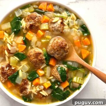 Classic Italian Wedding Soup Recipe — Authentic Homemade Flavor 10 close up of Italian wedding soup in bowl.