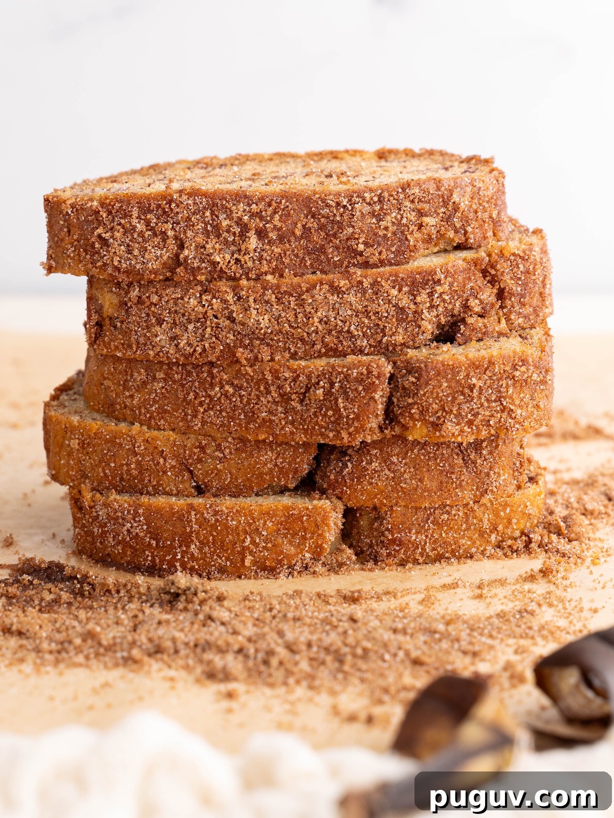 Cinnamon Swirl Banana Bread Recipe with Brown Sugar Swirl 9 Slices of banana bread stacked to show crunchy cinnamon sugar crust