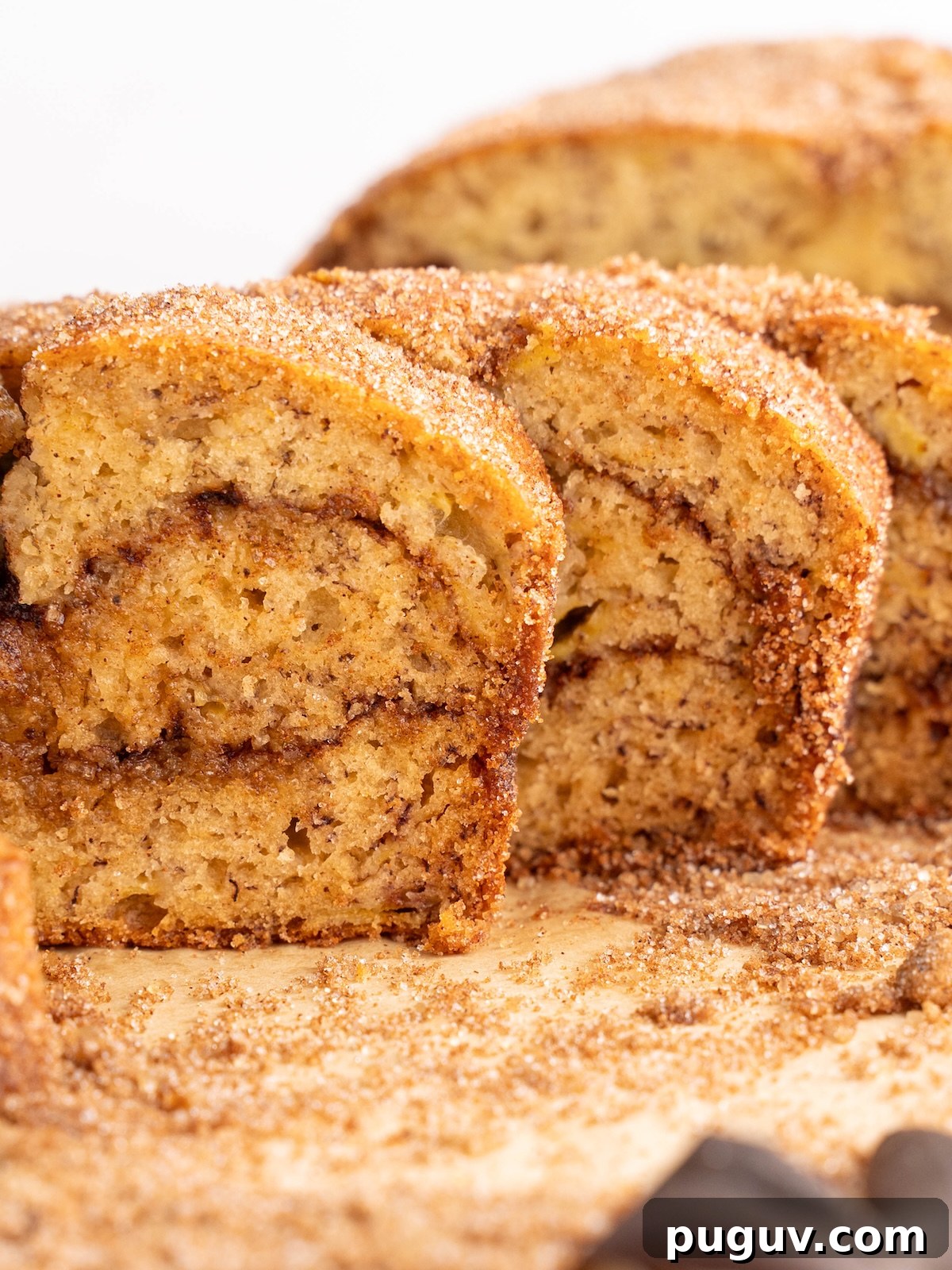 Cinnamon Swirl Banana Bread Recipe with Brown Sugar Swirl 10 Slices of banana bread with a cinnamon swirl throughout