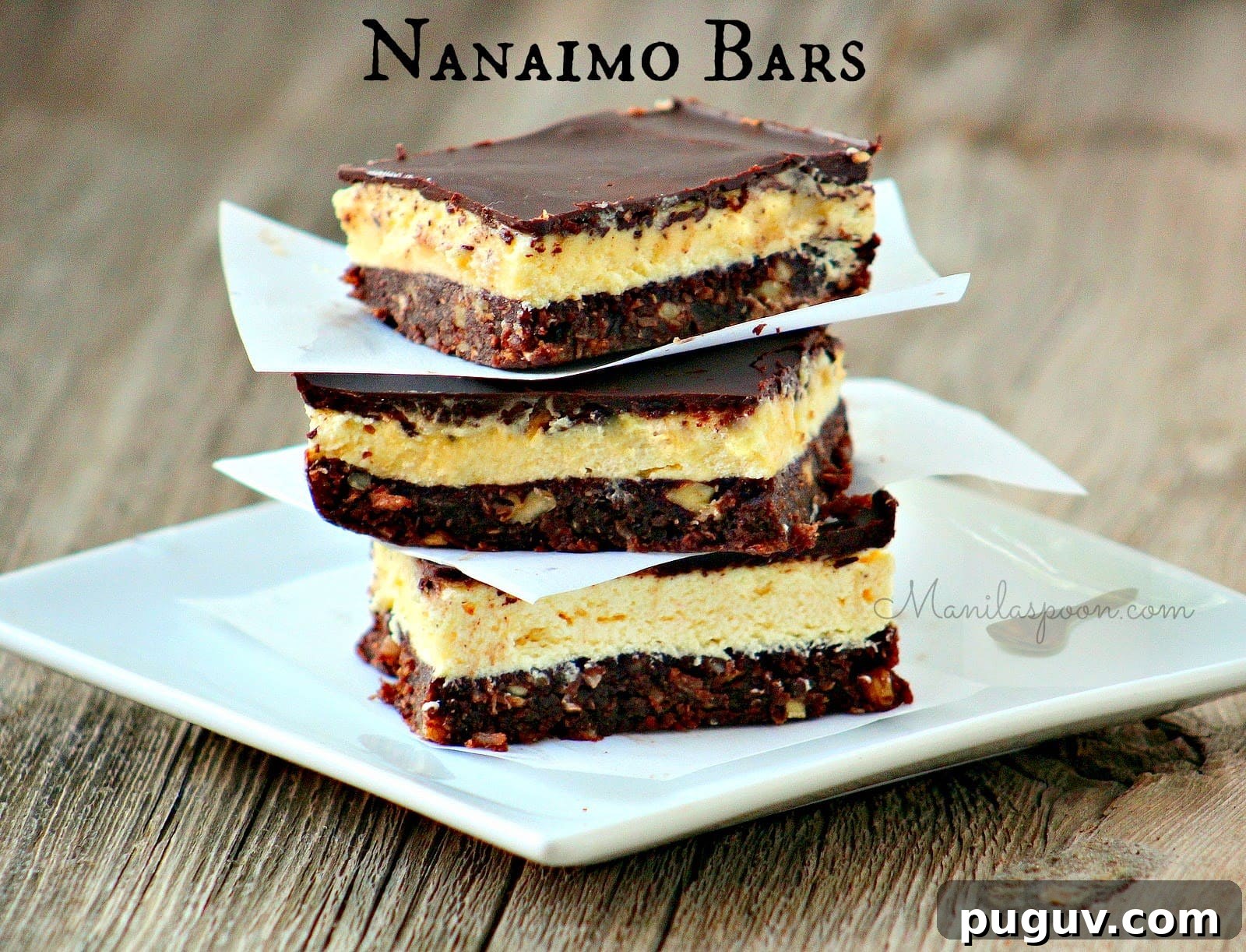 So addictively good, one bite and you're hooked! A bottom crust with nuts, cocoa and coconut, a middle layer of creamy vanilla custard filling and then melted and chilled chocolate on top! This is a GLUTEN-FREE version of the Canadian classic sweet treat - No Bake Nanaimo Bars. Freezable. No Bake Nanaimo Bars