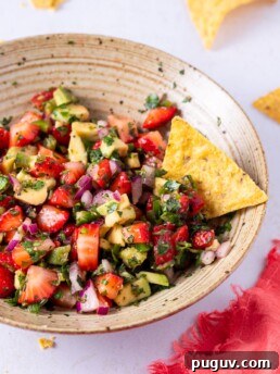 strawberry pico de gallo with a tortilla chip
