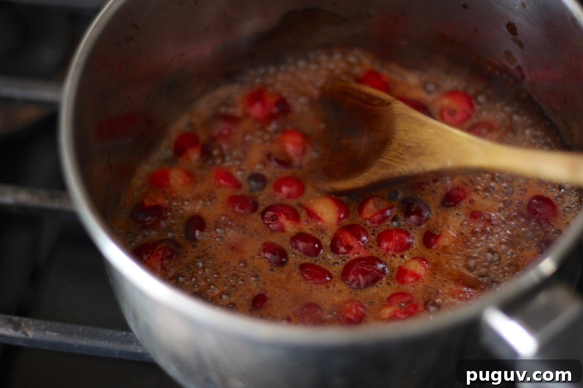 Instant Pot Whole Chicken with Cranberry Orange Sauce (AIP) - tender, juicy chicken is served with a tangy, sweet cranberry orange sauce for an amazing flavor combination! | fedandfulfilled.com