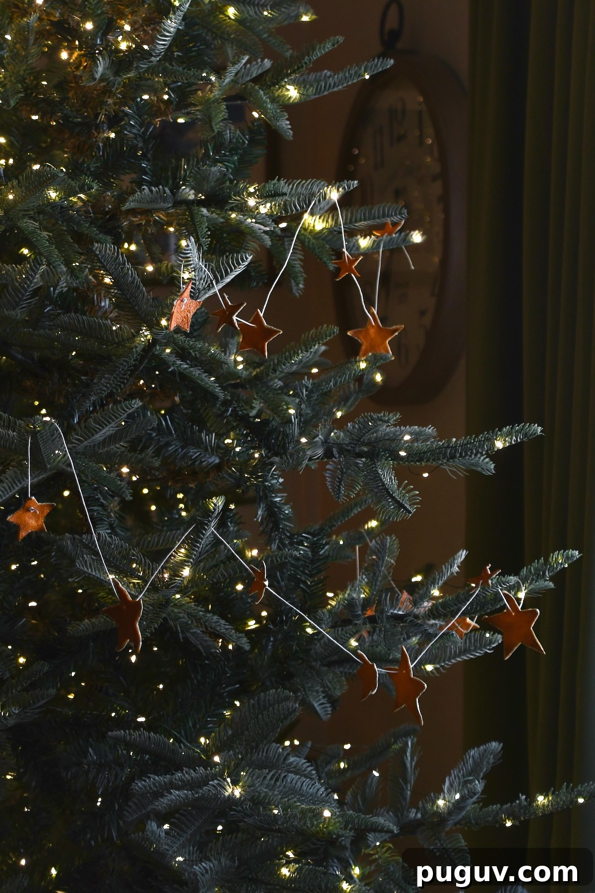 DIY Orange Peel Star Garland: Natural Holiday Decoration Tutorial 14 Orange Peel Star Garland strung up on a tree.