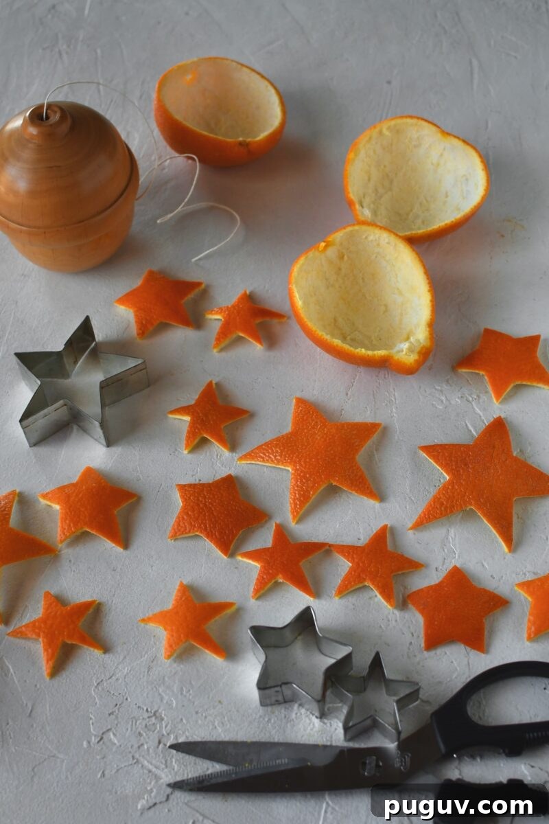 DIY Orange Peel Star Garland: Natural Holiday Decoration Tutorial 9 Cut out orange peel stars laid out on a table.