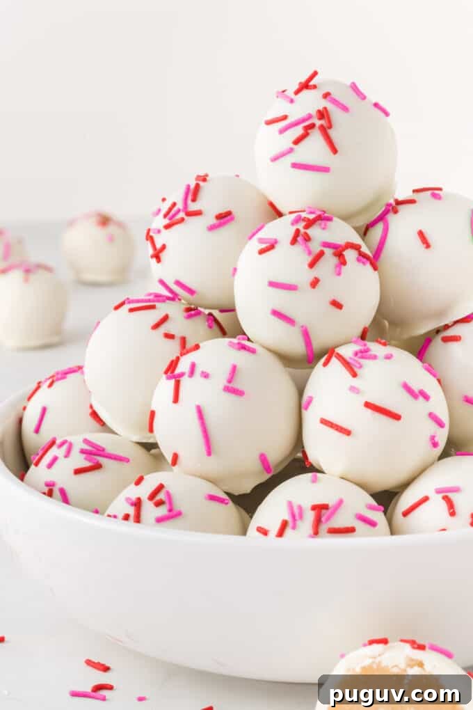 Valentine Sugar Cookie Truffles: Creamy Heart-Shaped Dessert Bites 12 bowl of sugar cookie Valentine truffles with red and pink sprinkles