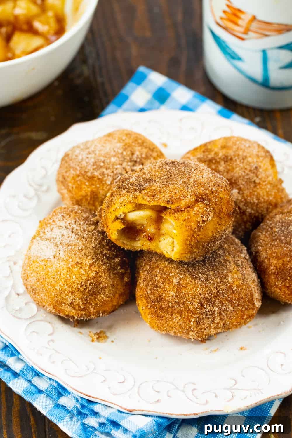 Air Fryer Apple Pie–Stuffed Biscuits: Quick Dessert Recipe 6 Apple Pie Stuffed Biscuits on a plate.