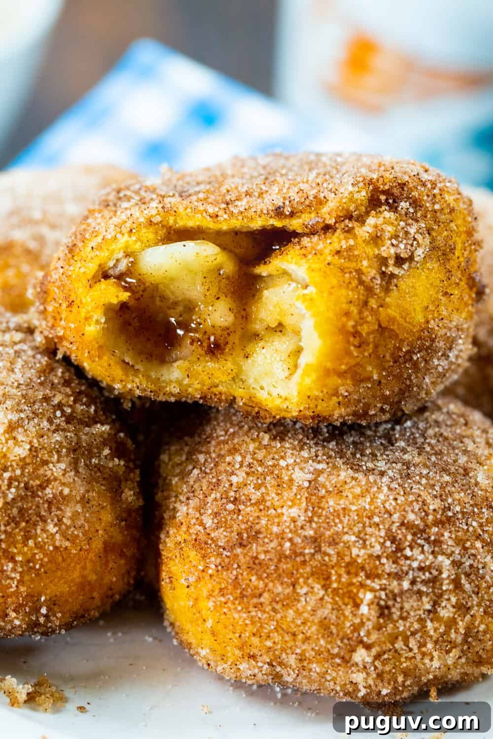 Air Fryer Apple Pie–Stuffed Biscuits: Quick Dessert Recipe 7 Close-up of Air Fryer Apple Pie Stuffed Biscuits with bite bitten out.