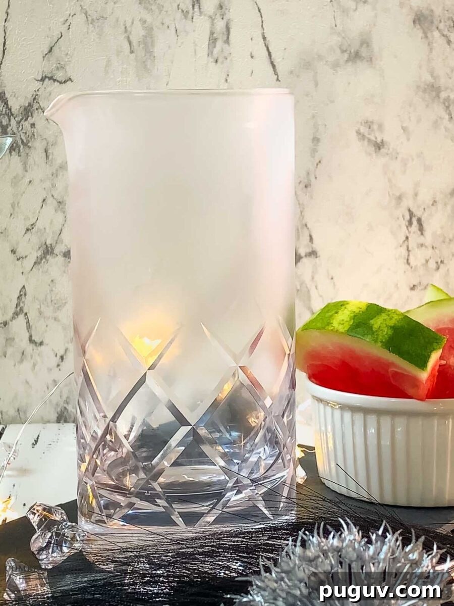 Refreshing Watermelon Martini Recipe: How to Mix the Perfect Cocktail 3 Place the chilled stirring glass on the table.