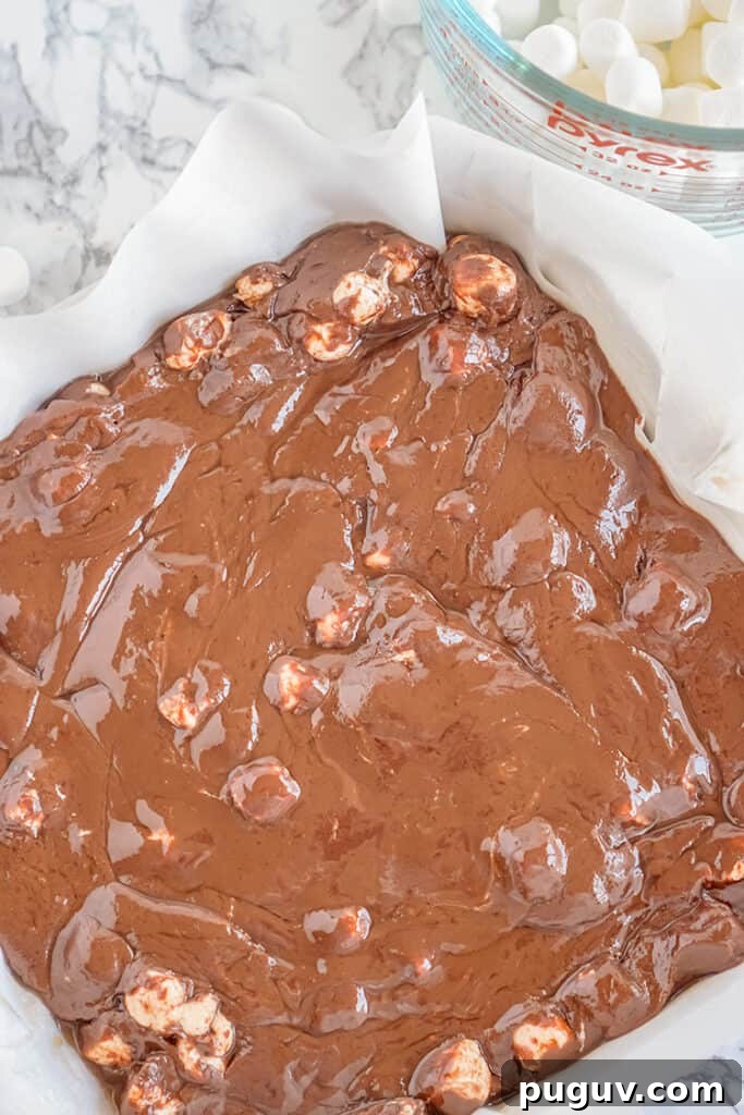 Decadent Hot Chocolate Fudge Recipe for Rich Cocoa Lovers 8 warm fudge in a square pan