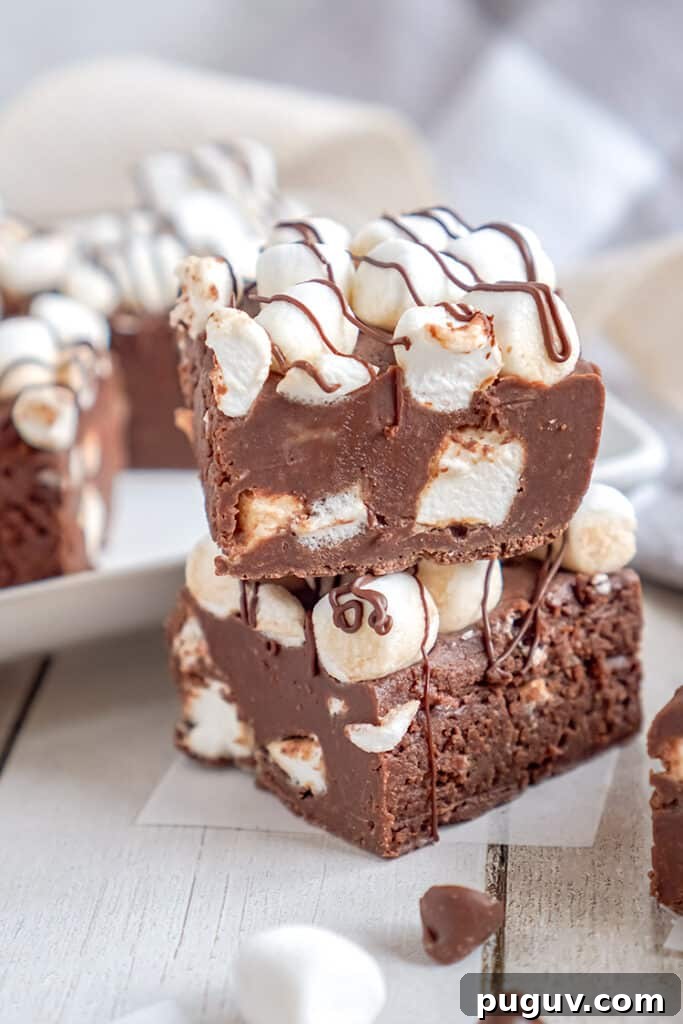 Decadent Hot Chocolate Fudge Recipe for Rich Cocoa Lovers 9 stack of fudge on a piece of wax paper