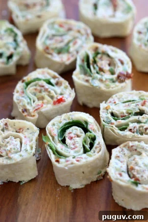 Tortilla Rolls Ups with Tofu herb cream cheese and Sun-dried tomato. Easy No Bake sun dried tomato pinwheels. Vegan Nutfree Recipe, can be gluten-free soy-free #Vegan#veganricha #tortillarollups #sundriedtotmatopinwheels