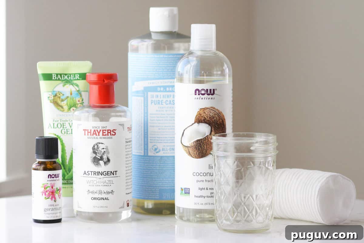 Make Your Own Coconut Oil Makeup Remover Wipes at Home 4 geranium essential oil, witch hazel, aloe vera gel, castile soap, fractioned coconut oil, a mason jar and cotton rounds on a table