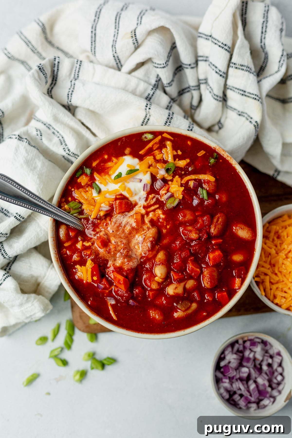 Smoky White Bean Vegetarian Chili — Slow Cooker Recipe 2 slow cooker vegetarian chili in a bowl with sour cream and cheese