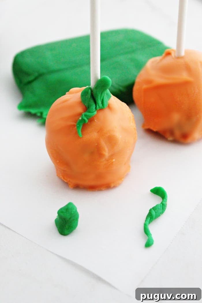 No-Bake Pumpkin Cookie Dough Pops — Fall Dessert Bites 8 Pumpkin pops are a perfect treat for a Halloween party. These pumpkin-shaped cookie dough pops are easy to make, no oven necessary!