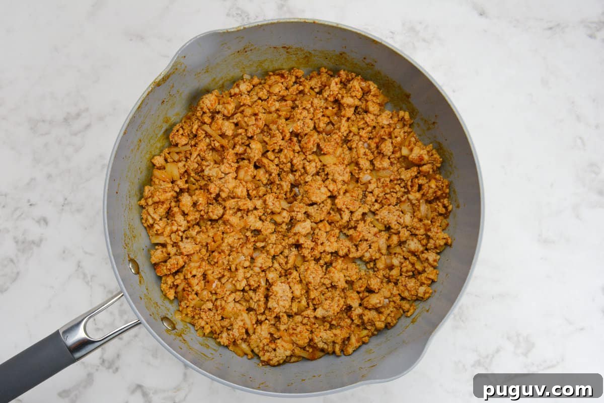 Doritos Casserole Recipe with WW SmartPoints and Tips 5 Taco seasoning now coats the chicken and makes it a reddish brown color.
