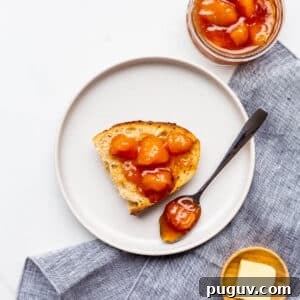 Peach jam served with sourdough bread and butter on the side.