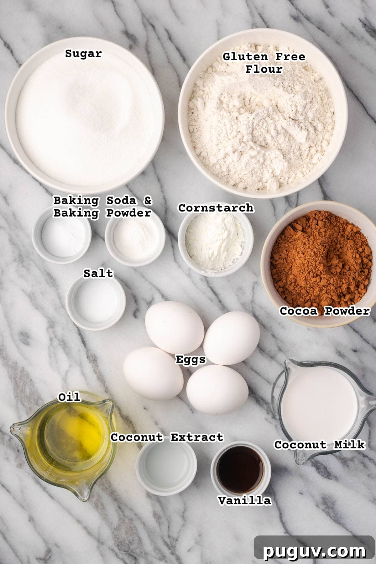 Decadent Chocolate Coconut Cake Recipe (Moist & Easy to Make) 3 Ingredients for a chocolate coconut cake sitting on a marble countertop.